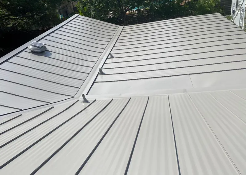 Solar attic fan installed on a metal roof for Roof Ventilation in Alameda